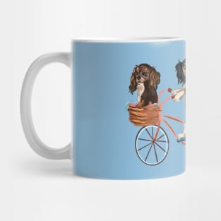 Four Cavalier King Charles Spaniels Riding a Bike Mug